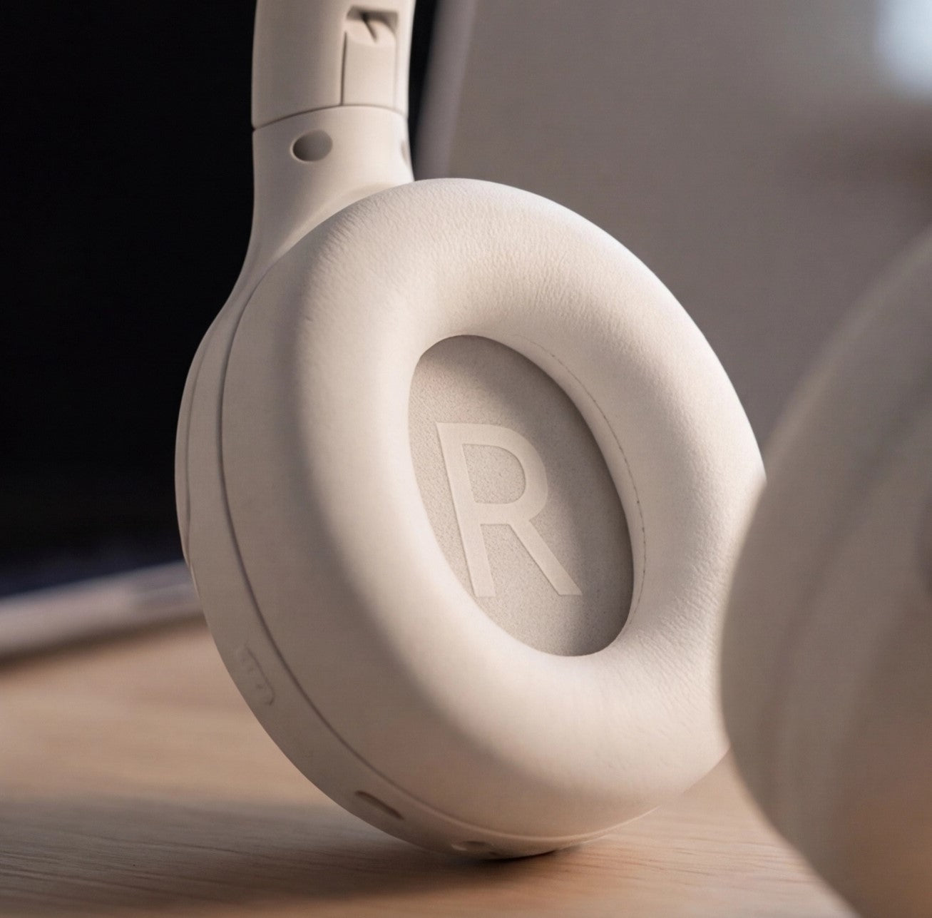 Eway QCY headphones in black, close-up of wireless earphones with charging case, showing sleek design and earbud details.