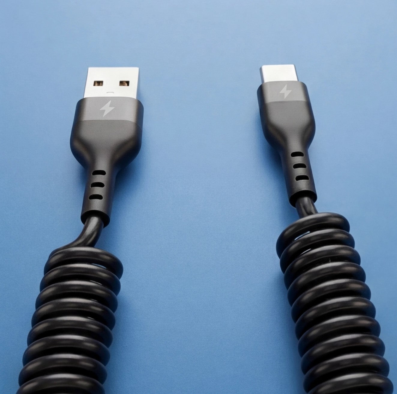 Eway Type-C retractable charging cable coiled with USB-C connector and adjustable length, ideal for versatile device charging.