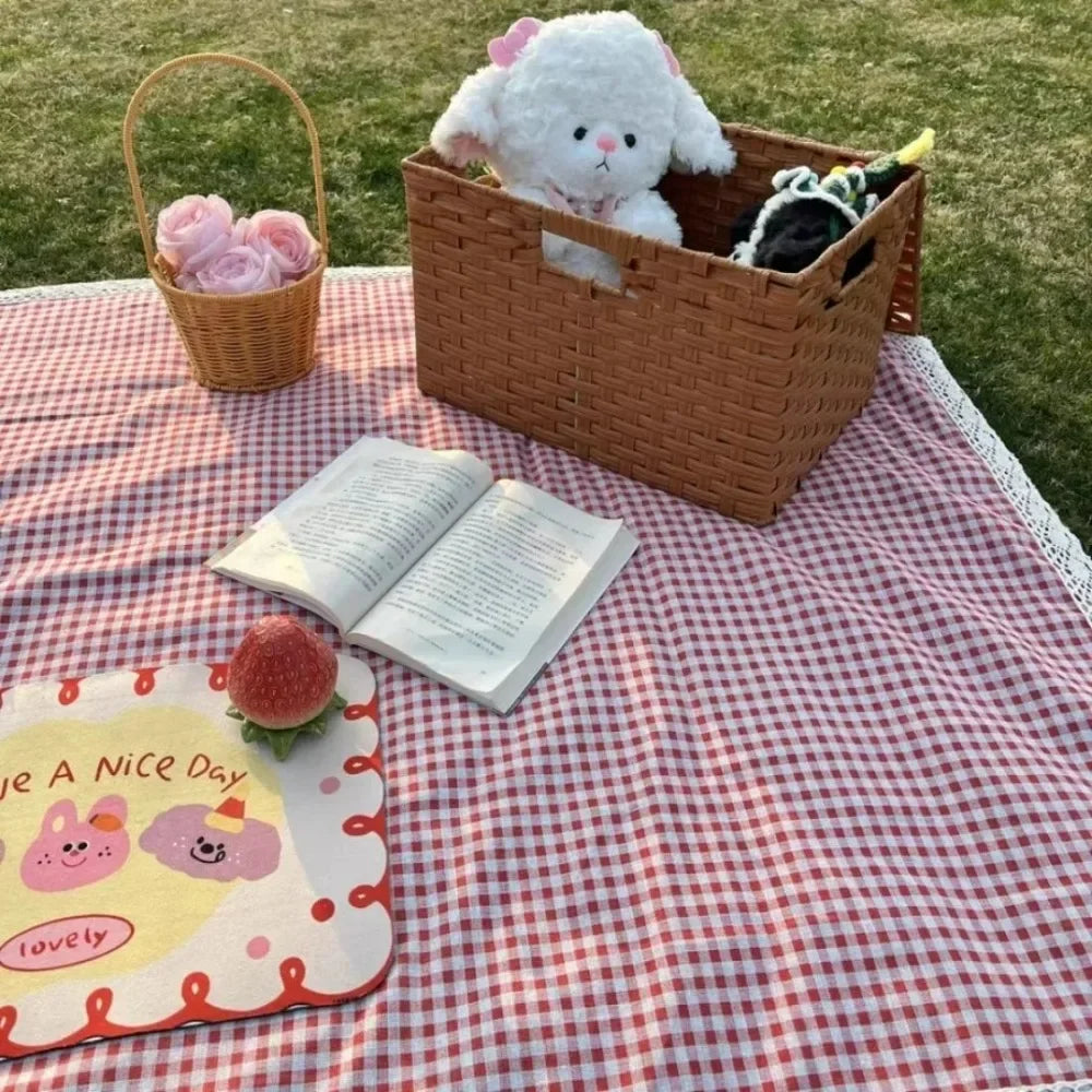 Eway canvas picnic mat spread out on grass, showing its durable fabric and spacious design for outdoor gatherings.