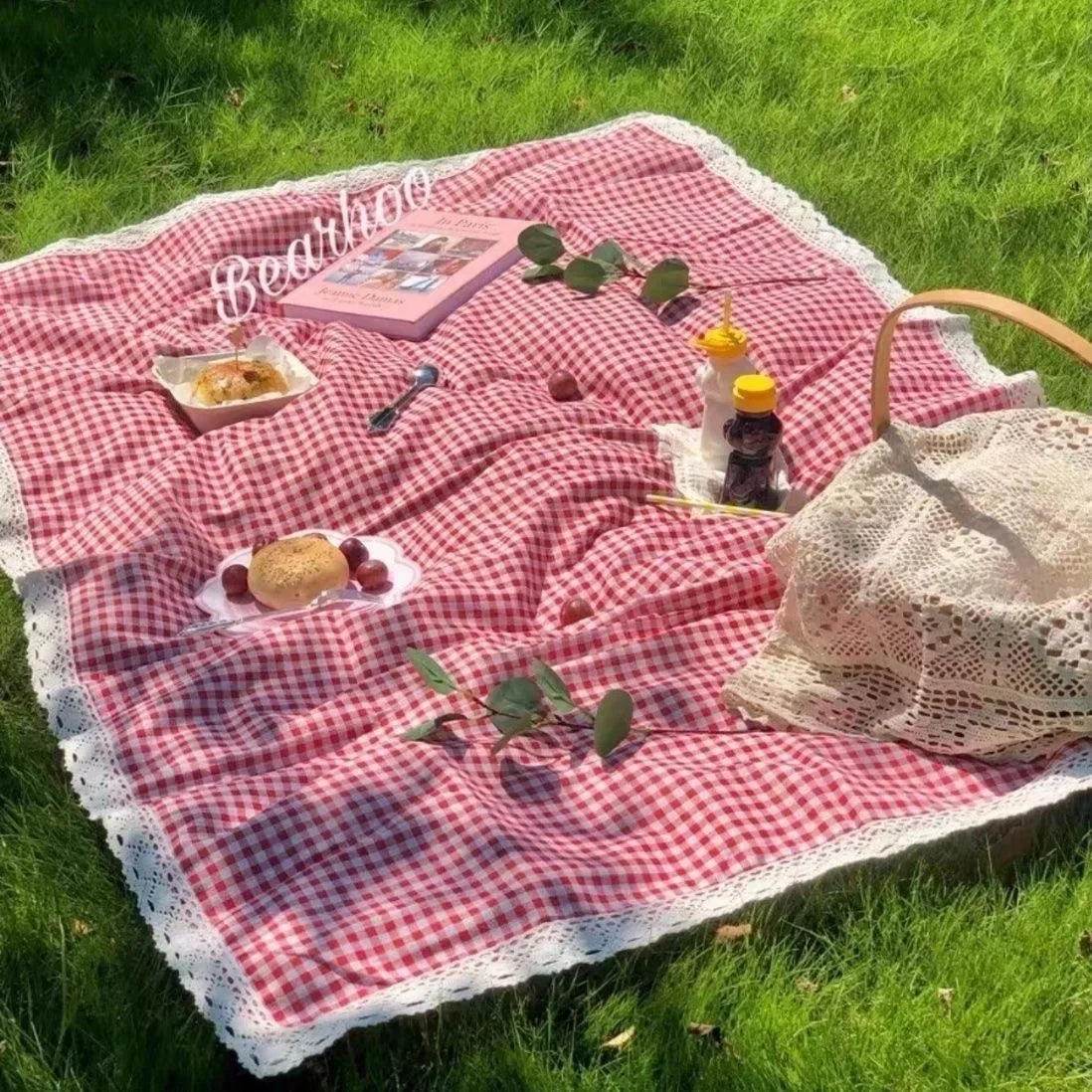 Eway canvas picnic mat with colorful striped pattern, spread out on grass for outdoor leisure and outdoor dining.