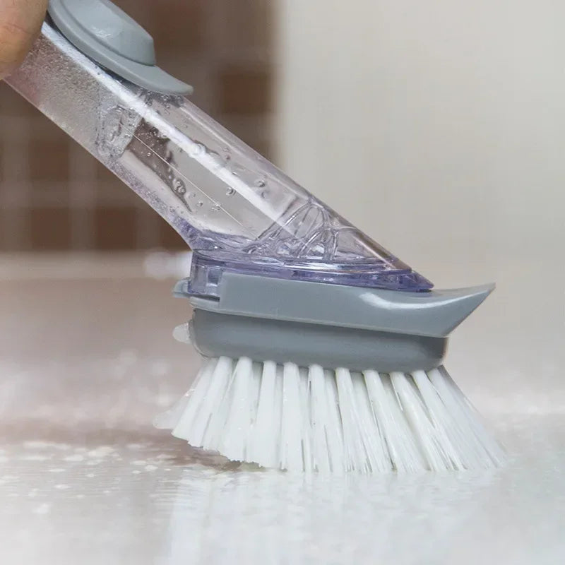 Eway 2-in-1 kitchen cleaning brush with integrated soap dispenser, featuring a durable handle and soft cleaning bristles.