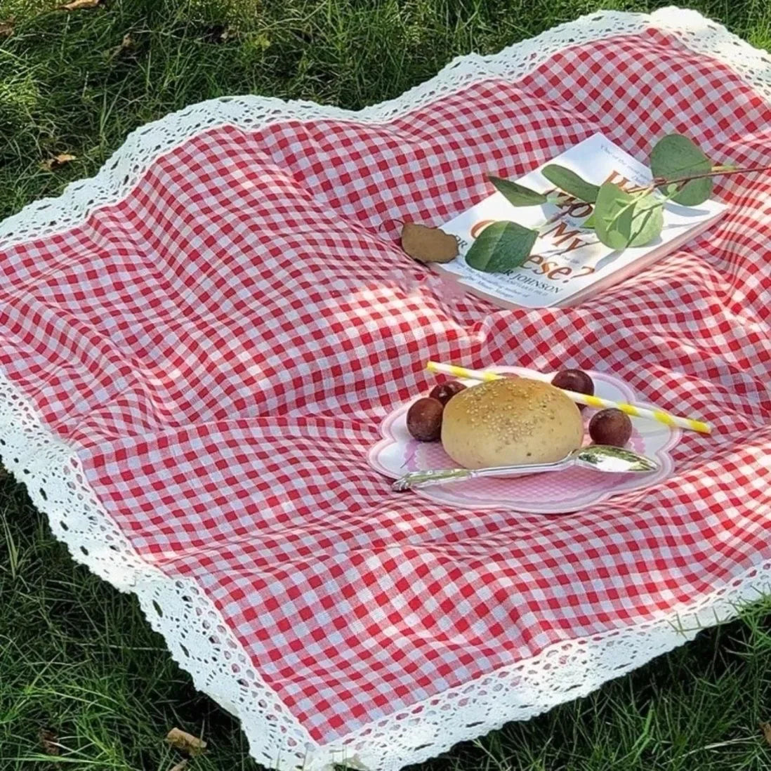 Eway canvas picnic mat spread on grass, durable outdoor fabric with colorful plaid pattern for outdoor picnics and gatherings.