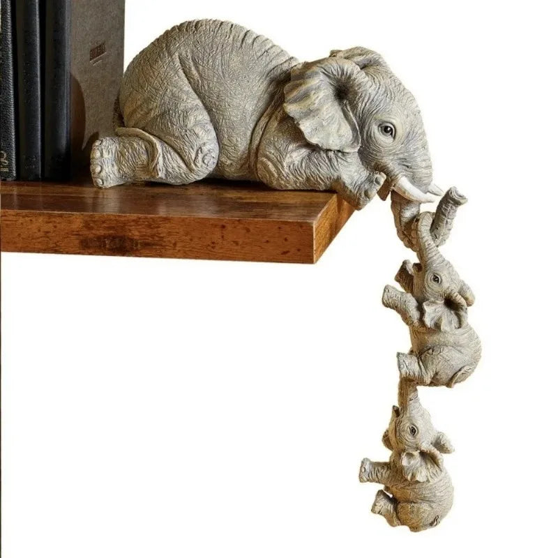 Set of three wooden elephant figurines by Eway, detailed handcrafted animal sculptures for home decor.