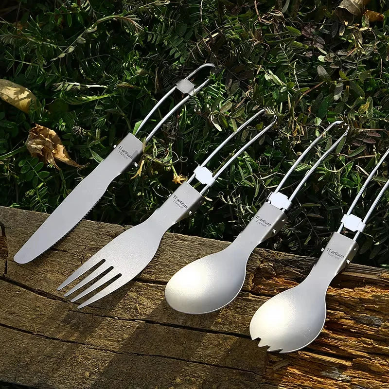 Eway Tiartisan titanium dining utensils set with fork, knife, and spoon arranged on a wooden surface.