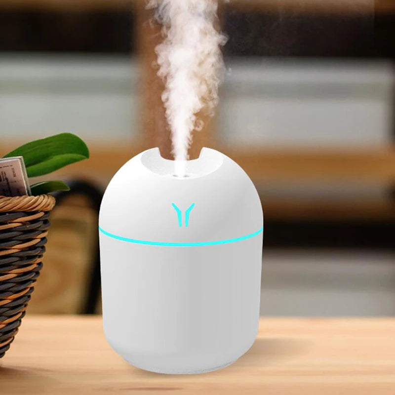 USB air humidifier with fragrance from Eway, showing the compact device emitting mist and infused with aromatic scent.