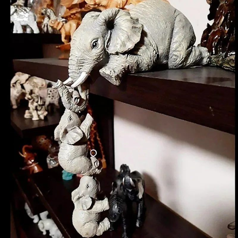 Set of three wooden elephant sculptures by Eway, handcrafted decorative figurines with detailed carved features.