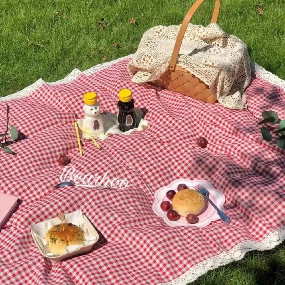 Eway canvas picnic mat spread out on grass, featuring colorful patterns for outdoor leisure and family picnics.