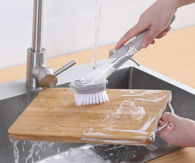 Eway 2-in-1 kitchen cleaning brush with soap dispenser, featuring a durable handle and soft bristles for scrubbing and rinsing dishes.