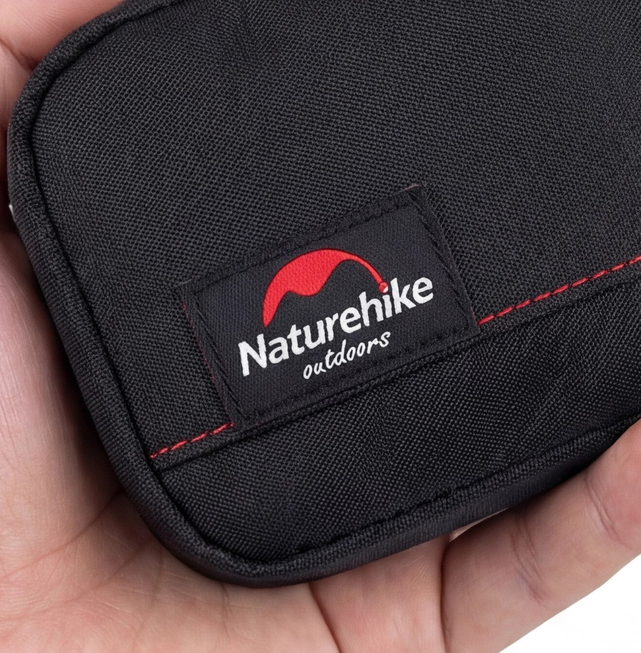 Eway Naturehike outdoor picnic mat laid on grass, showing its durable fabric and compact design for outdoor activities.